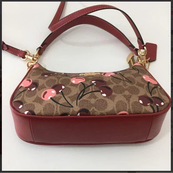 teri-shoulder-bag-signature-canvas-cherry-print Shoulder