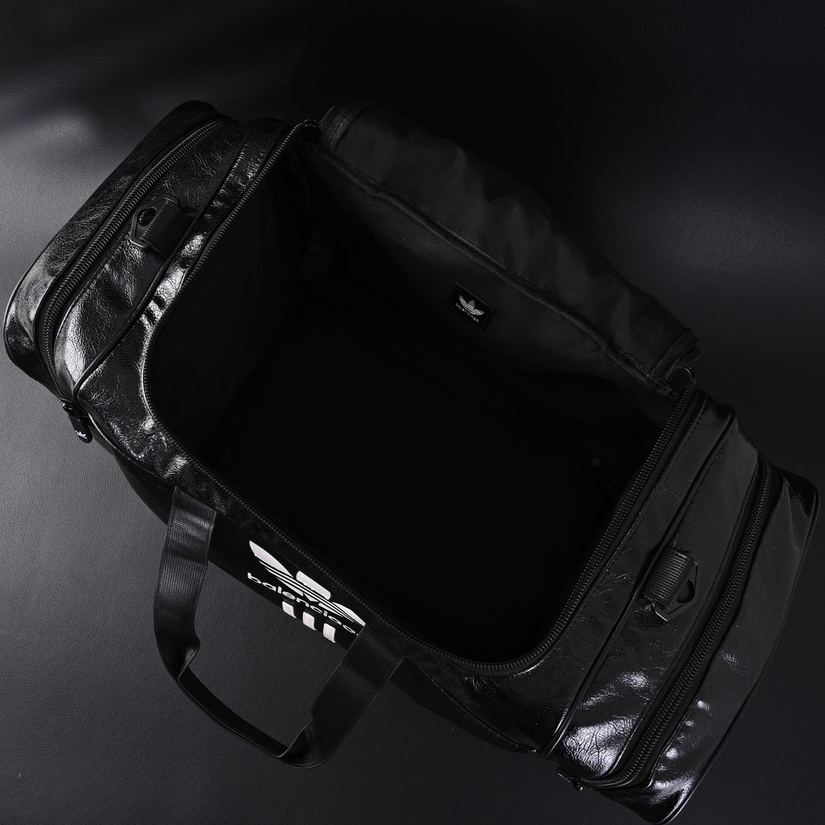 balenciaga-x-adidas-large-duffel-travel-bag-black-with-trefoil-logo-and-triple-stripes Handle