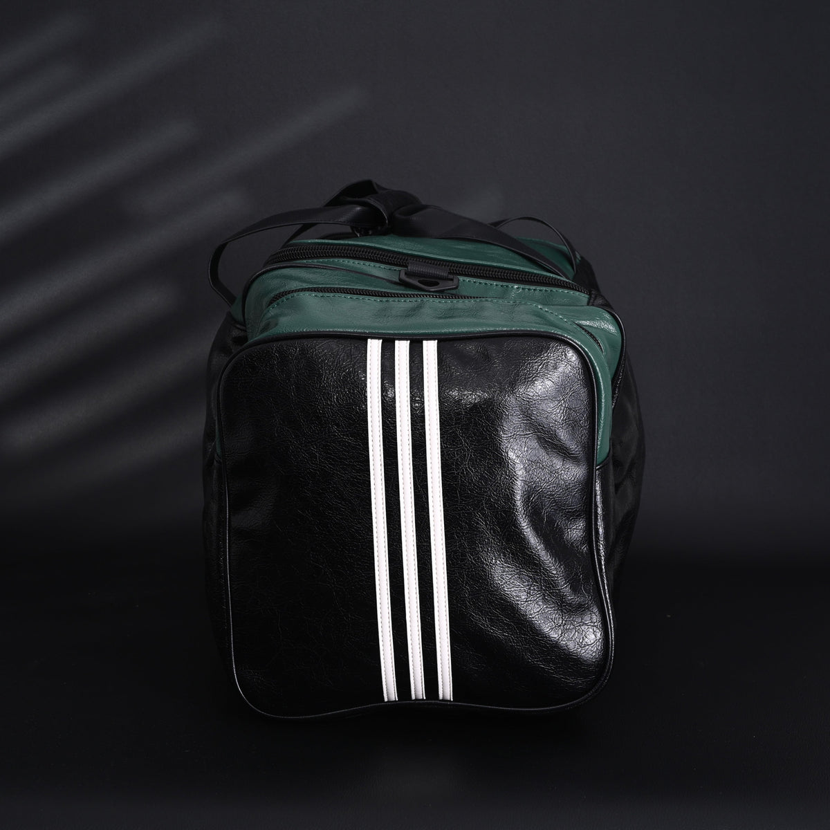 balenciaga-x-adidas-large-duffel-travel-bag-black-green-with-trefoil-logo-and-triple-stripes Handle