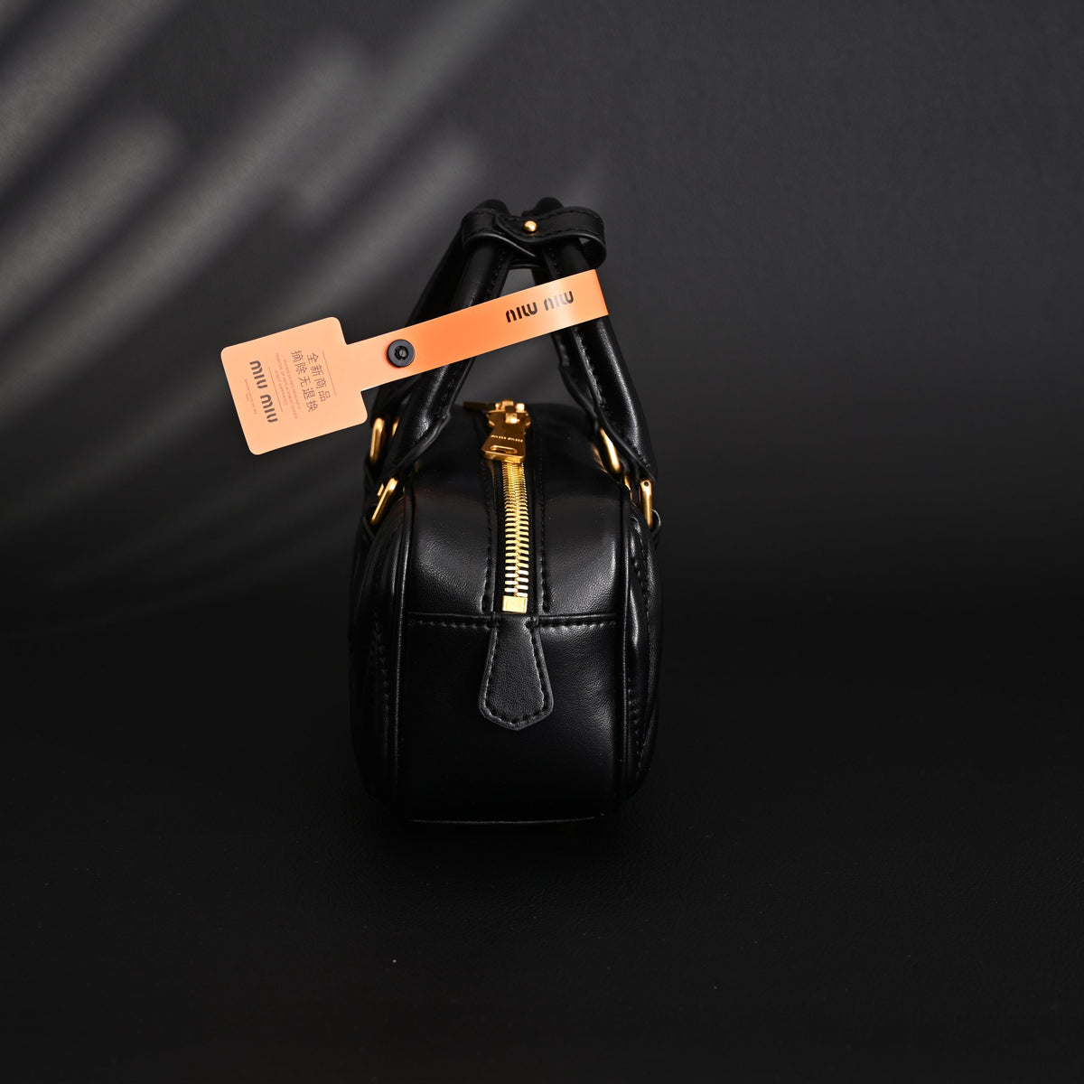 miu-miu-black-matelasse-leather-top-handle-bag Handle