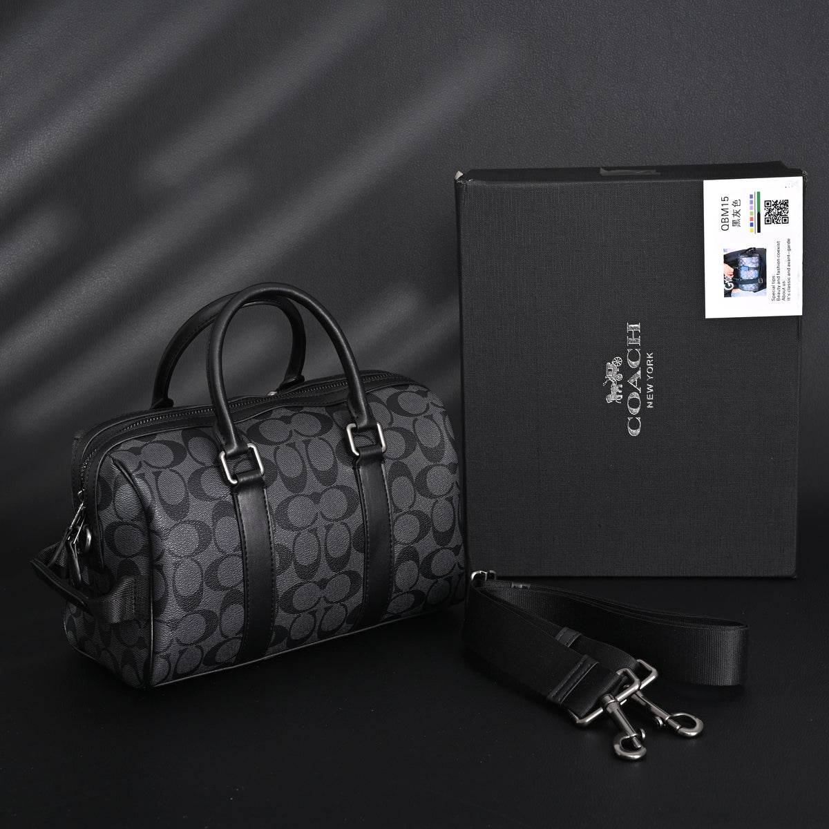 coach-signature-duffel-bag-black-monogram-canvas-with-leather-trim Handle