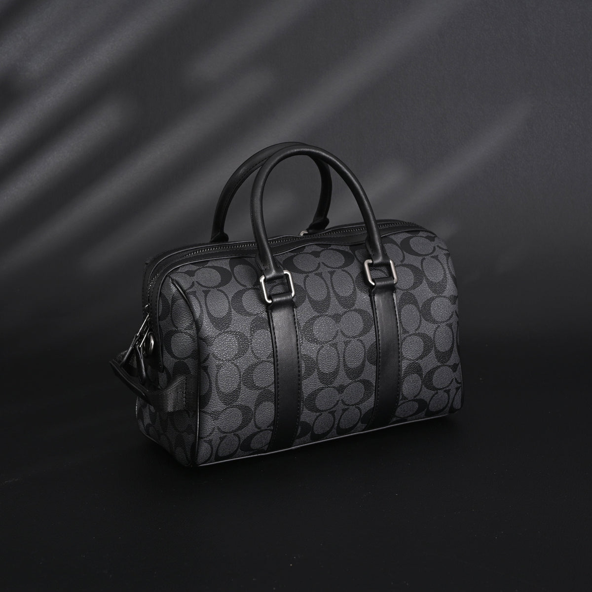 coach-signature-duffel-bag-black-monogram-canvas-with-leather-trim Handle