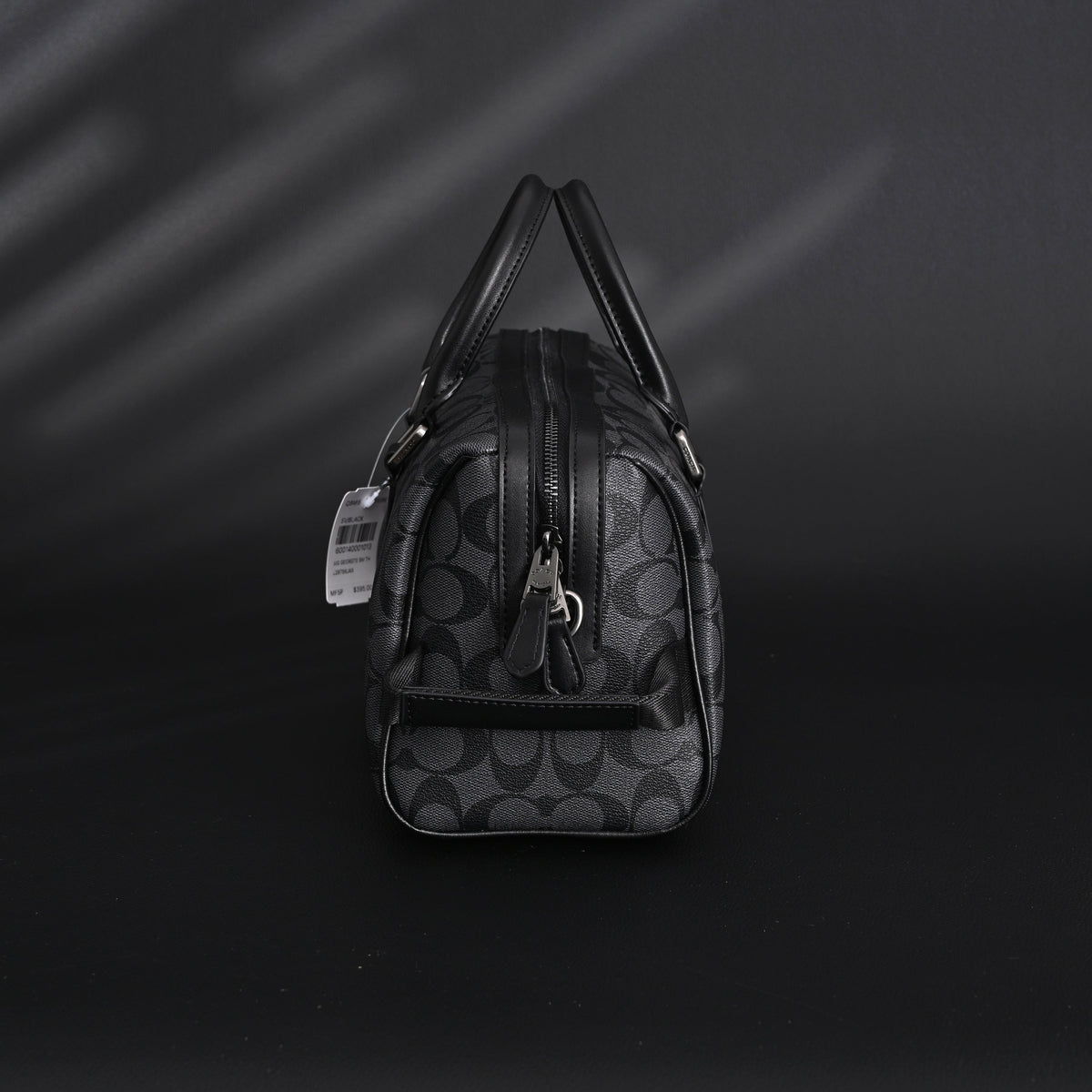 coach-signature-duffel-bag-black-monogram-canvas-with-leather-trim Handle