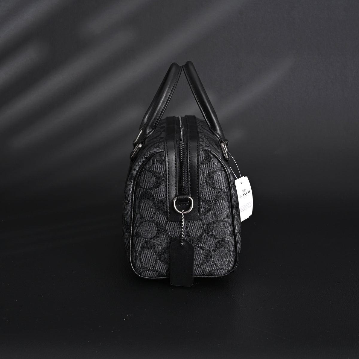coach-signature-duffel-bag-black-monogram-canvas-with-leather-trim Handle