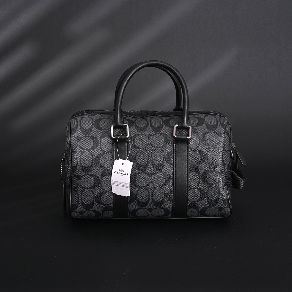 coach-signature-duffel-bag-black-monogram-canvas-with-leather-trim Handle