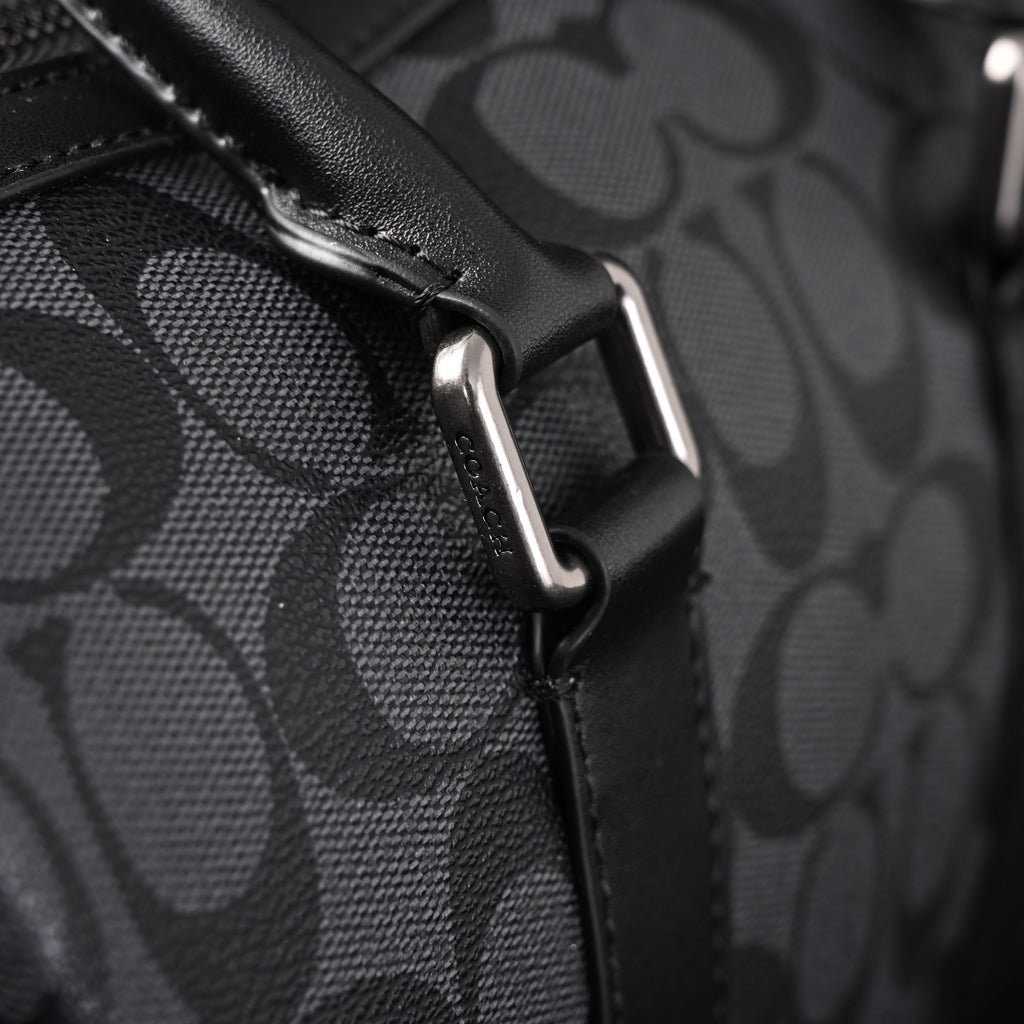 coach-signature-duffel-bag-black-monogram-canvas-with-leather-trim Handle