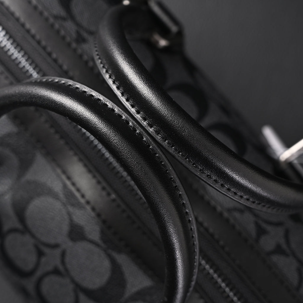 coach-signature-duffel-bag-black-monogram-canvas-with-leather-trim Handle