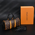 louis-vuitton-keepall-bandouliere-50-monogram-canvas-with-neon-orange-trim Handle