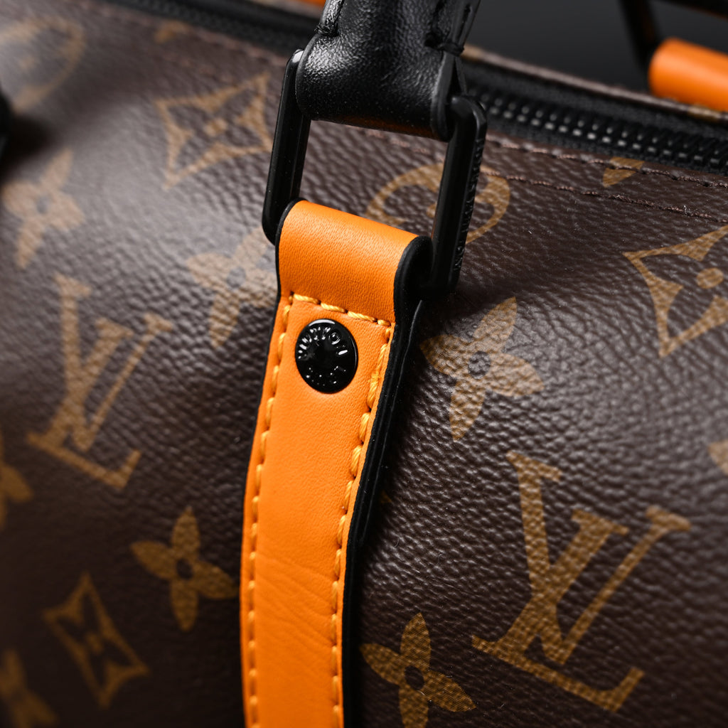 louis-vuitton-keepall-bandouliere-50-monogram-canvas-with-neon-orange-trim Handle