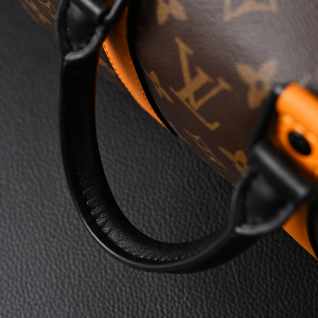 louis-vuitton-keepall-bandouliere-50-monogram-canvas-with-neon-orange-trim Handle
