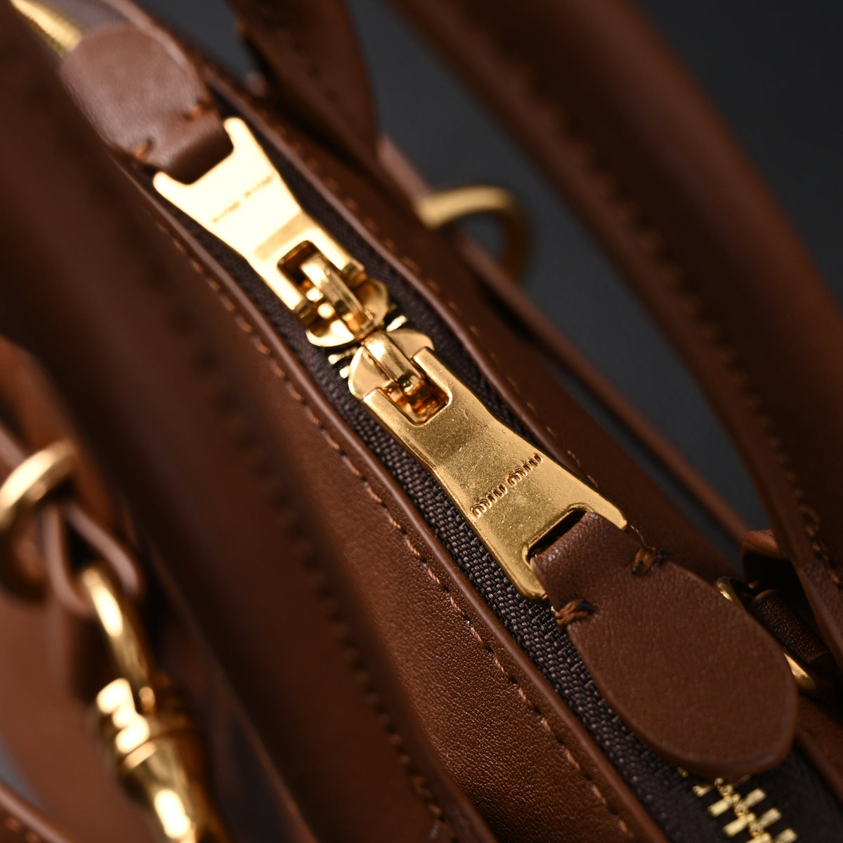 miu-miu-leather-bowler-top-handle-bag-cognac Handle