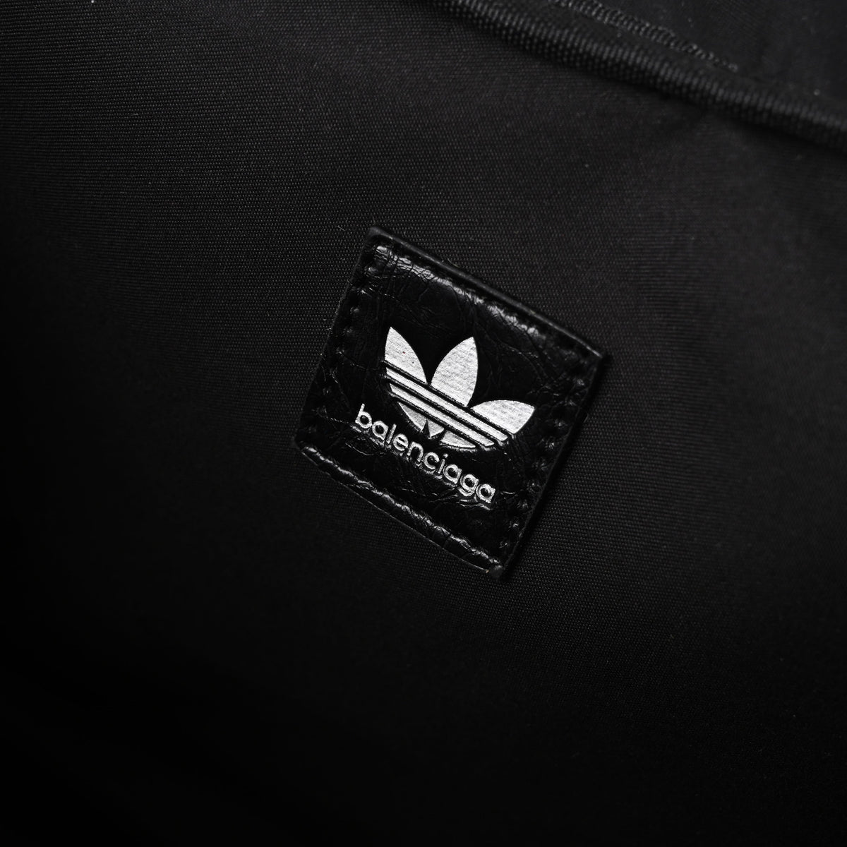 balenciaga-x-adidas-large-duffel-travel-bag-black-with-trefoil-logo-and-triple-stripes Handle